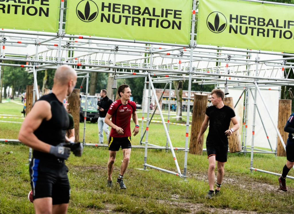 herbalife sports supplements banner at obstacle run